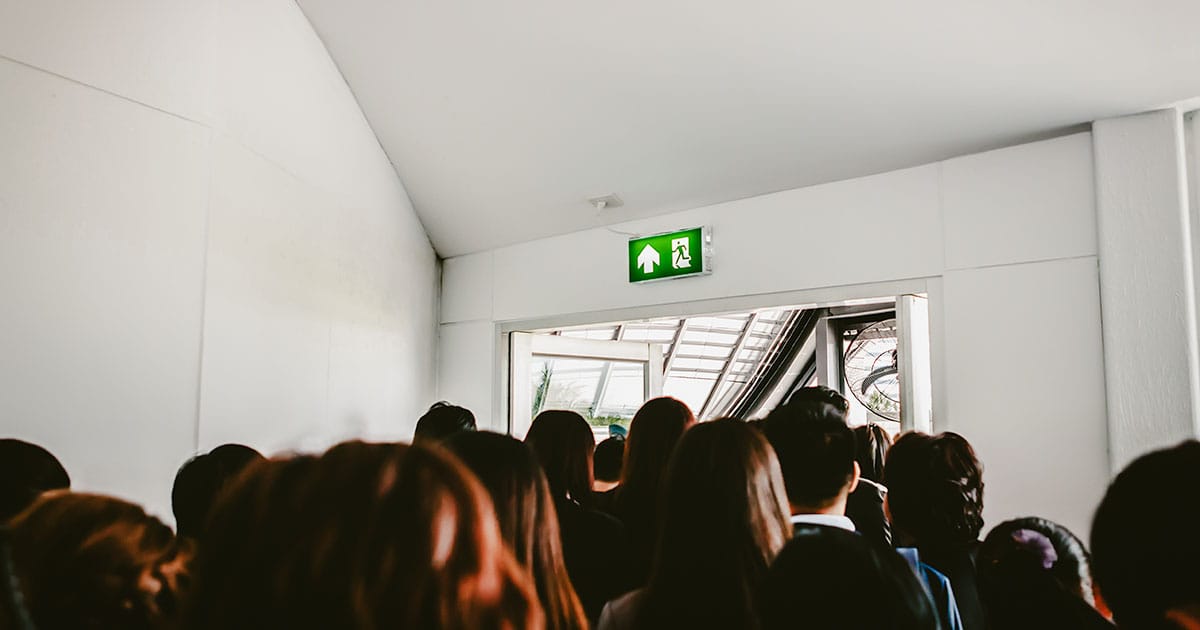 Crowd heading towards fire exit