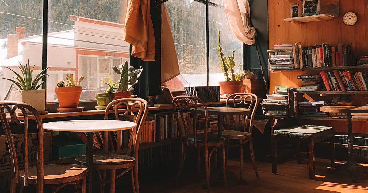 Cosy café with bookshelves