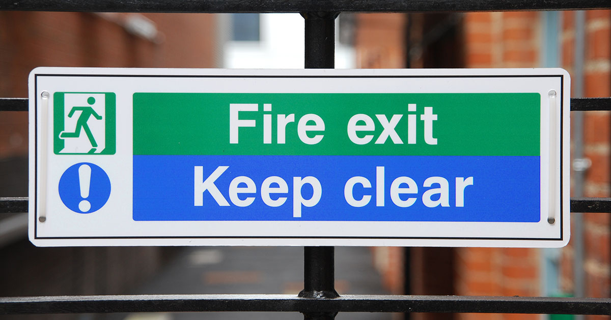 A fire exit sign should be placed at every designated final exit out of the building.