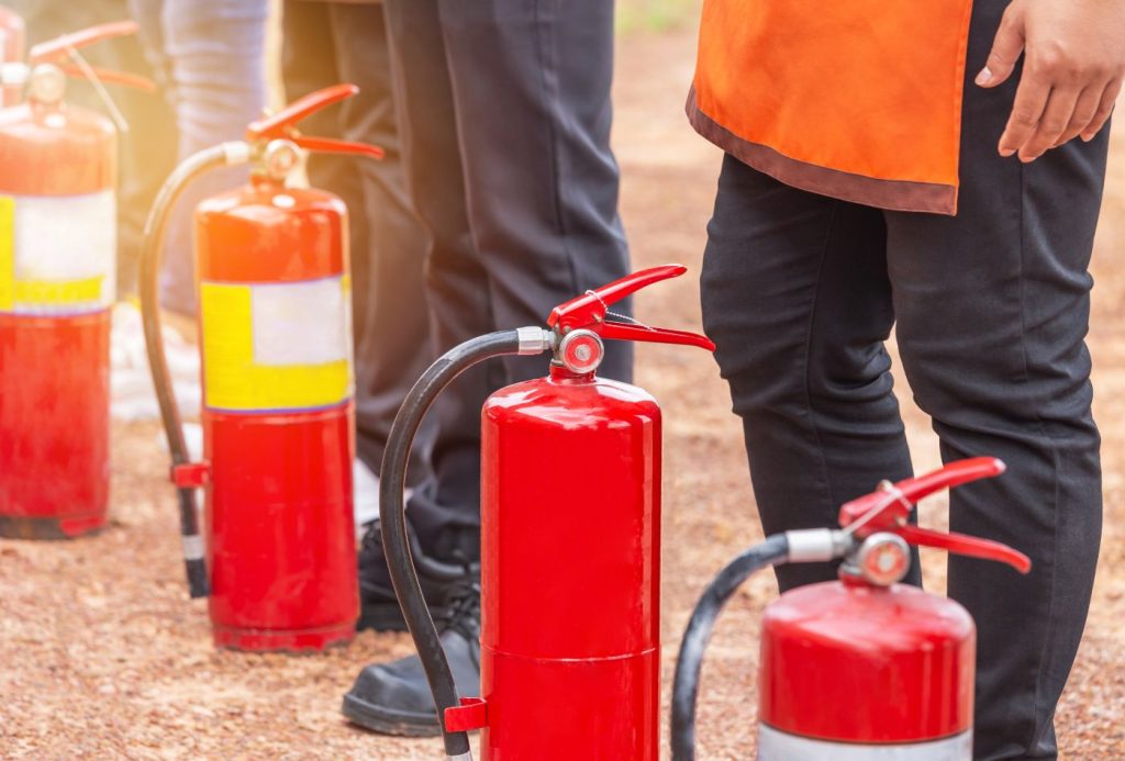 Row of fire extinguisher during training basic fire fighting