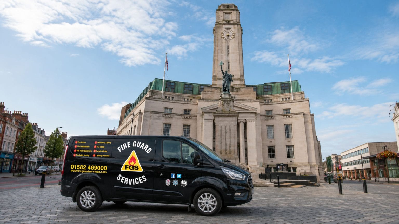Luton town hall with a Fire Guard Services van outside